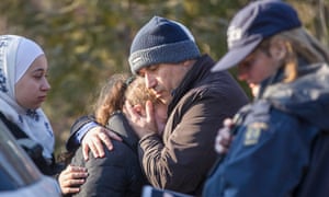 A man from Syria hugs his daughter after they were detained by the RCMP as they illegally crossed the US-Canada border near Hemmingford, Quebec, 28 February 2017. 2053.jpg?width=300&quality=85&auto=forma