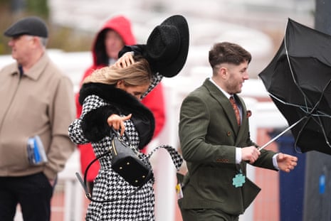 Cheltenham racegoers at a windy track today.