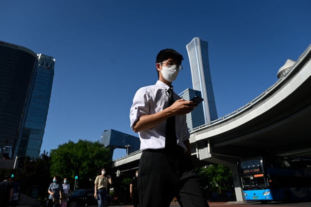 Pedestrians wearing face masks in central Beijing.