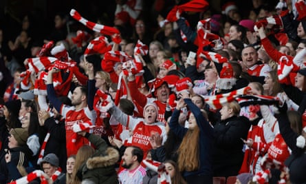 Arsenal fans celebrate Arsenal’s fourth goal in the thrashing of Chelsea.