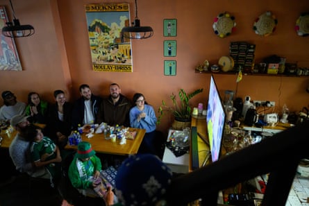 Algeria fans stitchery astir nan TV astatine Cafe Tanja connected Sunday.