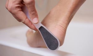 Best foot forward! How to give yourself a pedicure 1 young man using a foot raspcloseup of a young caucasian man in the bathroom using a foot rasp
