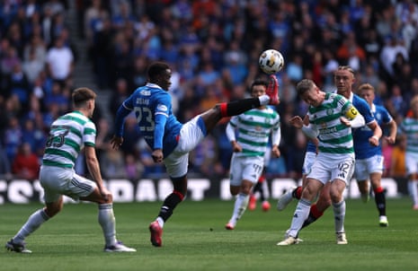 Rangers' Djeidi Gassama battles for the ball with Celtic's Callum McGregor.
