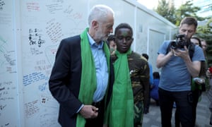 Jeremy Corbyn at a memorial wall on the one year anniversary of the Grenfell Tower fire