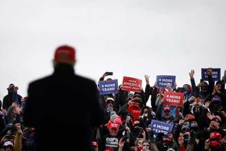 Supporters attend Trump’s campaign rally in Washington, Michigan, Sunday.