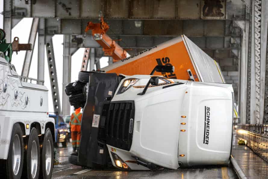 Crews work to upright an overturned truck on the Richmond-San Rafael Bridge in Richmond, California in October.