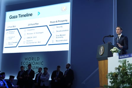 Kushner speaks at a podium on stage, as a screen displays a 'Gaza timeline' for the plan