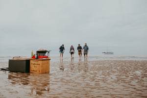 Patrick Barkham and the Salford’s crew arrive on the sandbank for their picnic lunch and game of cricket.
