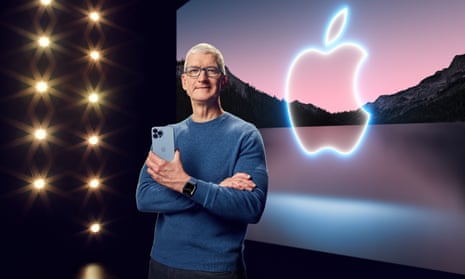 Tim Cook with the iPhone 13 Pro Max and Apple Watch Series 7 during a launch event in Cupertino, California in September.