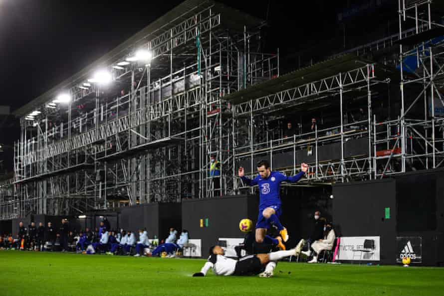A view of of the partially constructed Riverside Stand at Craven Cottage as Kenny Tete of Fulham tackles Ben Chilwell of Chelsea.
