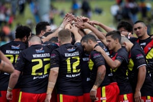 The Newcastle All Blacks huddle before the start of the clash