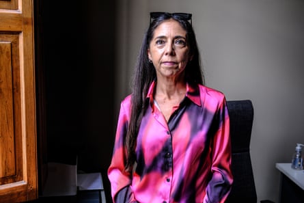 Portrait of a woman wearing a pink and purple shirt