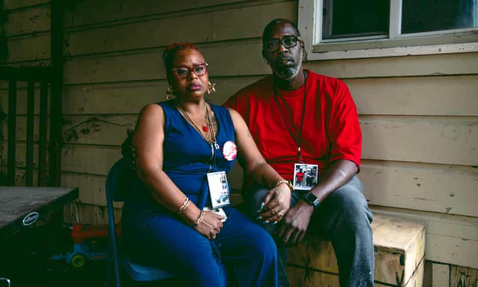 LaTanya and André Robinson wear necklaces in memory of their son André Robinson Jr, who was shot and killed on 8 November.