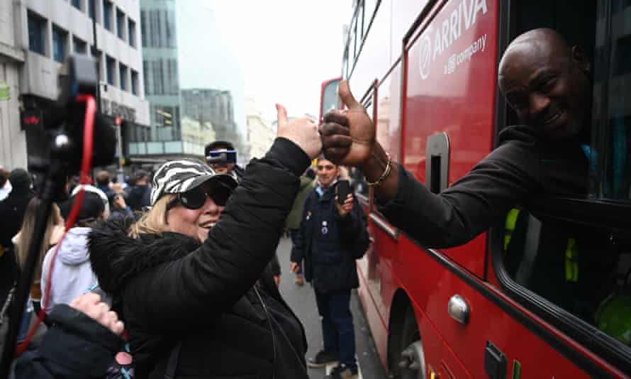 A woman and a bus driver during an anti-lockdown protest in London, 20 March 2021