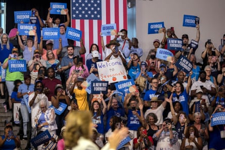 Politics tamfitronics crowd of people hold up blue signs
