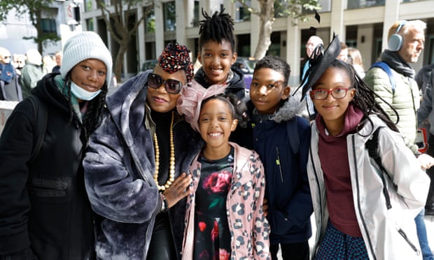 Mourners sprint for final probability to affix queue for the Queen’s lying-in-state | Queen Elizabeth II 4 Deborah Adeoye with her daughter Kemi (far left) and nieces and nephew Jasmine, India, Zachary and Safiya