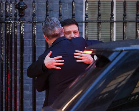Ukrainian President Volodymyr Zelenskyy is embraced by British prime minister Keir Starmer while leaving 10 Downing Street, in London, Britain.