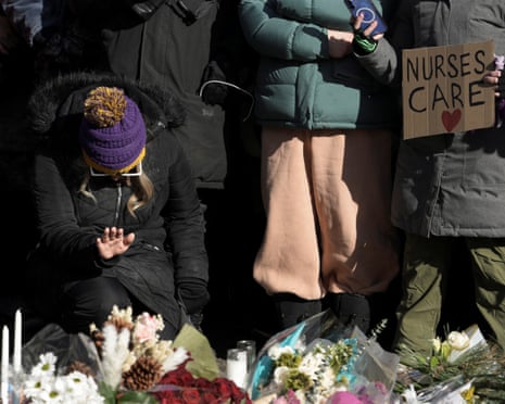 People gathered at a makeshift memorial at the Minneapolis site where Alex Pretti was fatally shot