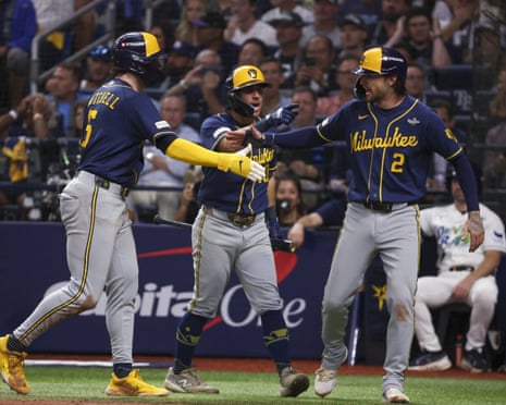 Milwaukee Brewers players Mitchell, Frelick and Turang celebrate together during a World Series game