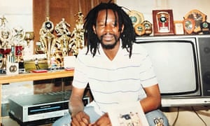 Errol Graham surrounded by his football trophies