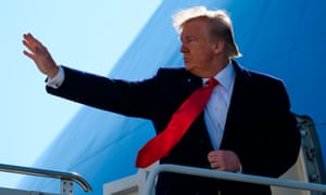 Donald Trump waves as he boards Air Force One at John F Kennedy airport in New York City.