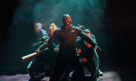Michael Akinsulire, in the title role, and company in Othello.