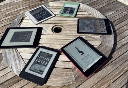 e readers organized in a circle on a table outside