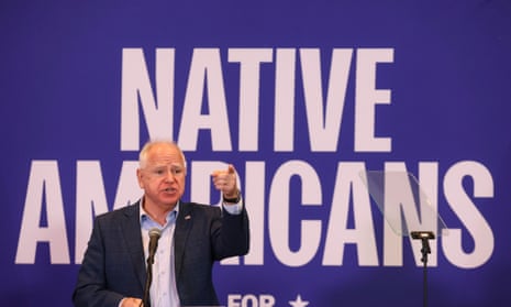 A man points in front of a graphic that says "Native Americans"