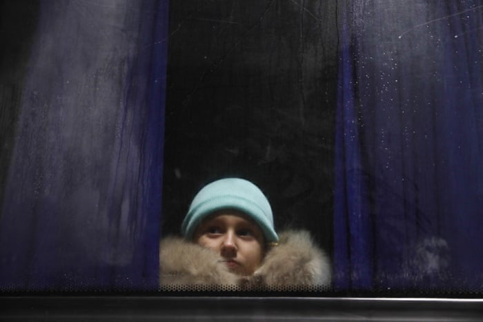 A girl fleeing from Ukraine arrives by bus to a parking lot in Przemysl, Poland on 2 March.