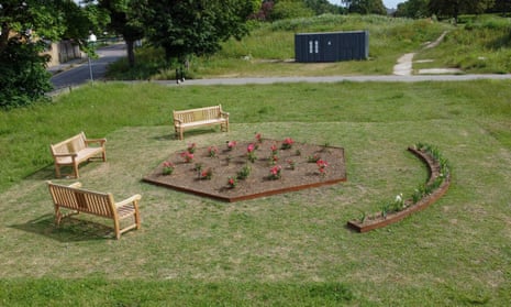 An English Garden by Gabriella Hirst in Gunners Park consisted of flowerbeds planted with Atom bomb roses and Cliffs of Dover irises, and three park benches.