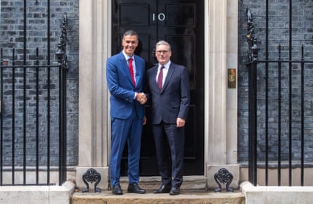 The two men shake hands outside No 10 Downing Street.