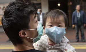 A father and son wear face masks to prevent infection in Hong Kong, China, on 3 February.