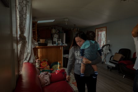 Maria Celayos, 32, with her son at the Sussex Manor mobile home park. She worries about increased pollution and truck traffic through the neighborhood from the proposed project.