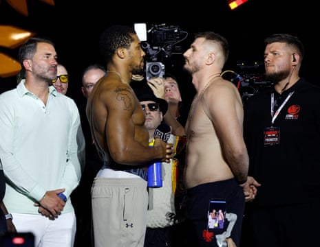 Anthony Joshua (left) and Kristian Prenga look disconnected astatine Friday’s weigh-in Jeddah, Saudi Arabia.