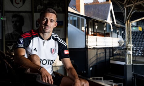 Timothy Castagne sits in the old-style stand, Craven Cottage’s actual cottage in the background.