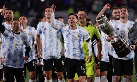 Lionel Messi and his teammates celebrate by displaying  the Copa América trophy at the end of the win over Bolivia.
