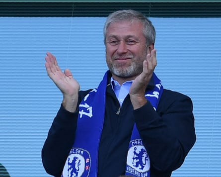 Roman Abramovich applauds as Chelsea players celebrate their Premier League title win in May 2017.