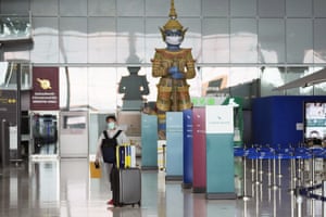 A lone passenger at Suvarnabhumi airport in Bangkok, Thailand,.