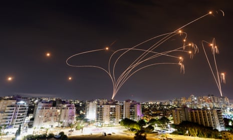 Israel's Iron Dome anti-missile system intercepts rockets launched from the Gaza Strip, as seen from the city of Ashkelon, Israel