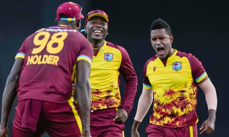 West Indies' Akeal Hosein (right) celebrates after he bowled England's Will Jacks.