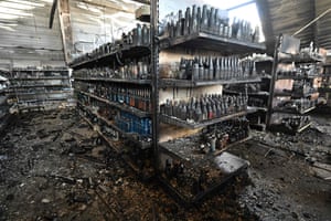 Kremenchuk, Ukraine. Charred goods on the shelves of a grocery store in the destroyed Amstor mall, after it was hit by a Russian missile strike