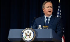 David Cameron at podium with US flag behind him