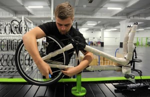 A worker constucts a Frog Bike