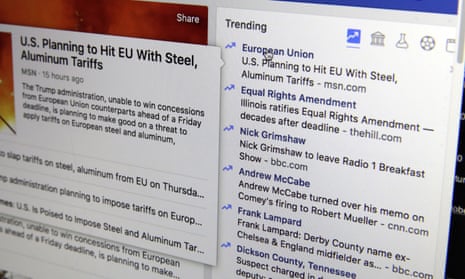 Facebook's trending news section displayed on a screen