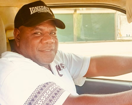 Bus driver Daniel Thomas at the wheel of his bus