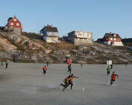 Locals play football in Ilulissat, Greenland