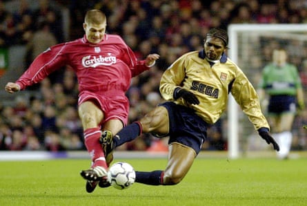 Kanu ‘tackles’ Steven Gerrard during a frantic first half at Anfield.