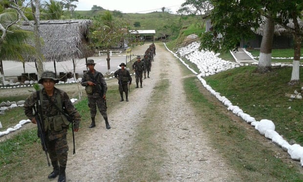 A handout photo released by Guatemala army shows Guatemalan soldiers patrolling in the Petén department, near the border with Belize on Thursday.