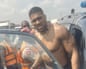 Anthony Joshua gets into an emergency responders’ vehicle at the scene of his crash in Nigeria