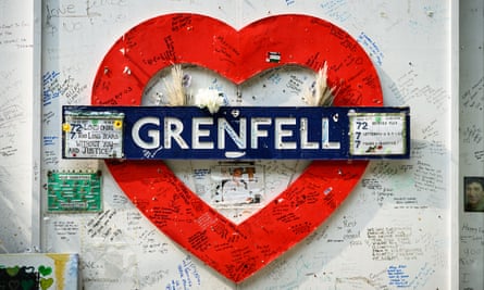 Messages written on hoardings around a heart-shaped Grenfell sign